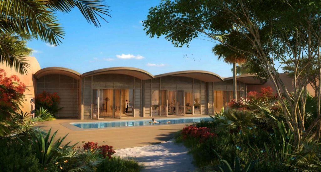 A luxurious resort at the Red Sea featuring modern architecture, designed to blend with its natural surroundings, and highlighting a private pool and lush greenery.