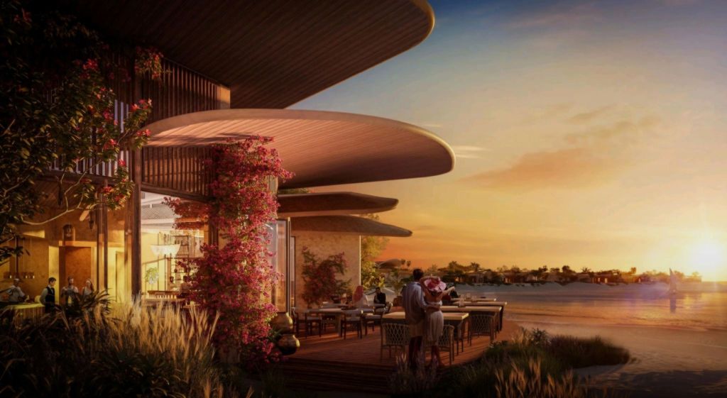 Exterior view of the Four Seasons Resort at the Red Sea at sunset, showcasing modern architecture with a patio adorned with vibrant flowers.