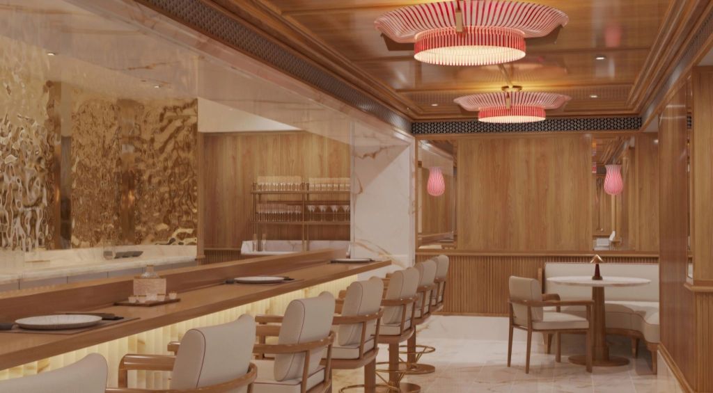 Interior view of a luxurious dining space on a yacht, featuring elegant wood paneling, modern lighting, and a stylish counter with seating.