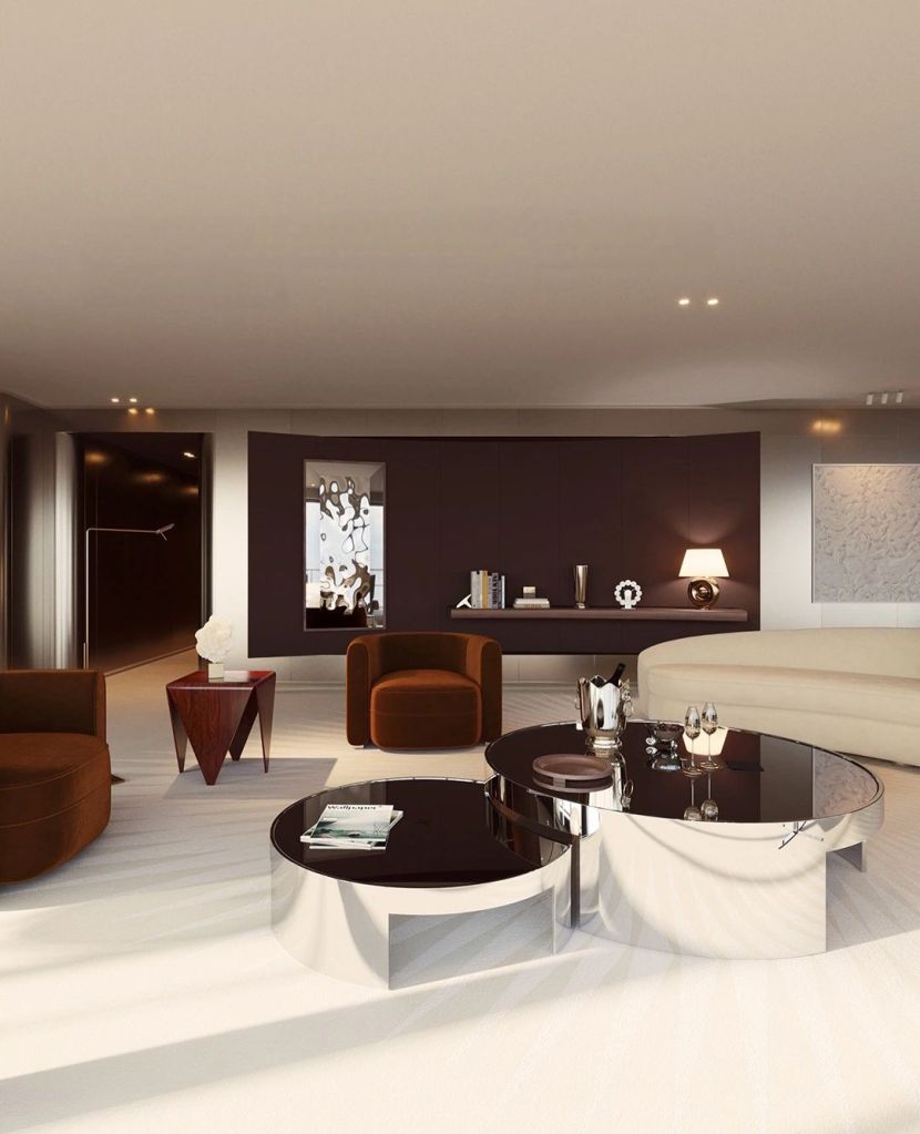 Luxurious living room interior of the Orient Express Corinthian, featuring elegant furniture, modern decor, and sophisticated color palette.