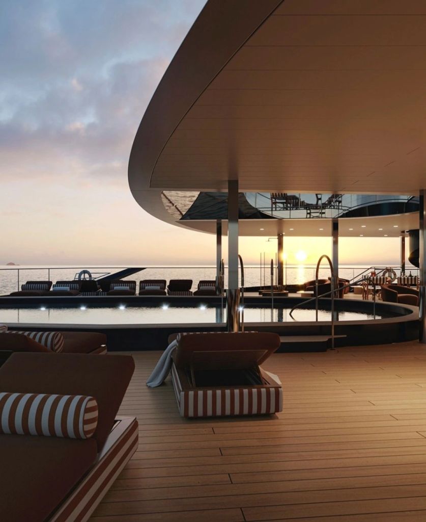 A luxurious outdoor deck of the OE Corinthian yacht, featuring lounge chairs and a swimming pool, with a stunning sunset over the ocean in the background.