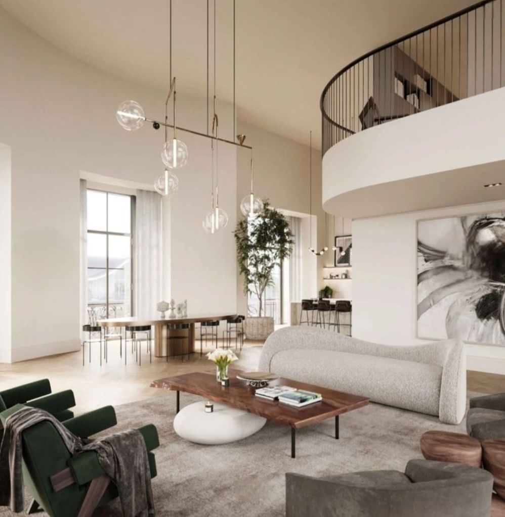 A modern living space featuring elegant furniture, large windows allowing natural light, and stylish decor, reflecting a contemporary luxury lifestyle.