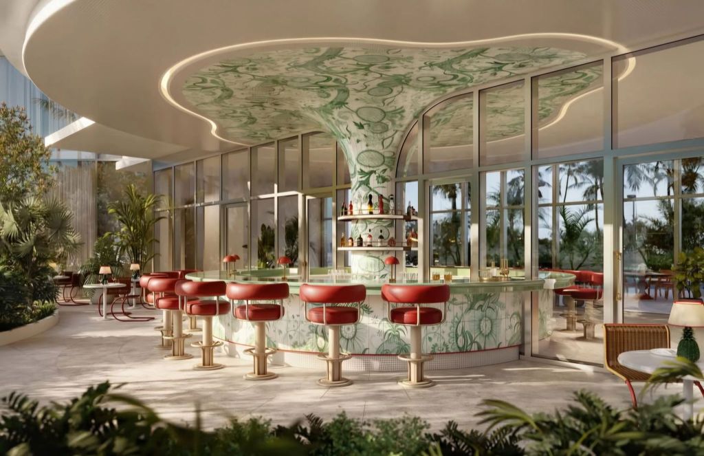 A luxurious bar area featuring a uniquely designed ceiling with green patterns, surrounded by elegant seating and lush plants, creating a serene and stylish atmosphere.