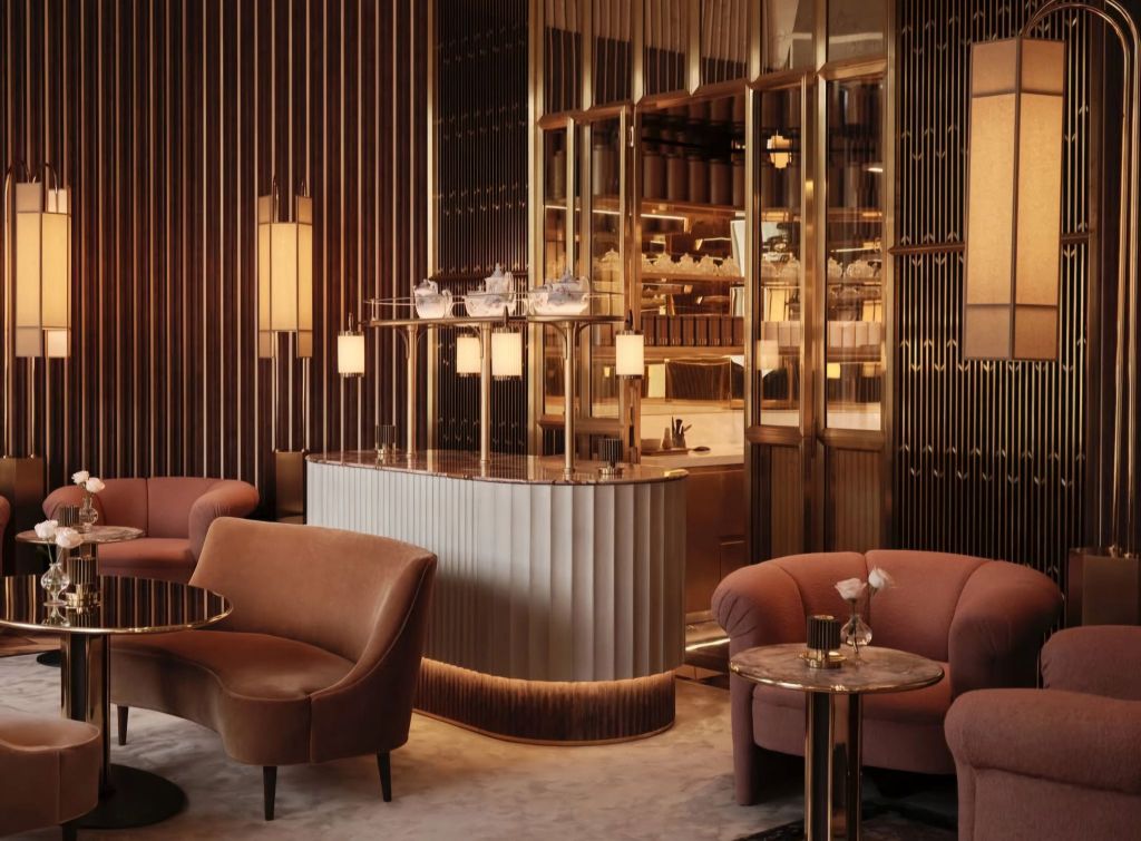 Interior of a luxurious lounge area at The Chancery Rosewood, featuring elegant seating, decorative lighting, and a stylish bar.